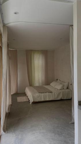 a bedroom with a large bed in a room at Raíces, The Jungle Penthouse in Santa Marta