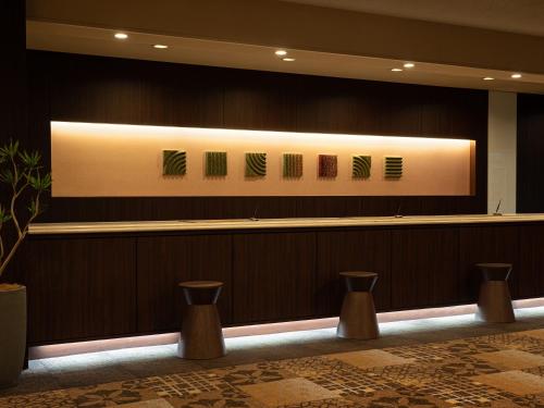 a lobby with a large sign on the wall at Grand Mercure Nara Kashihara in Kashihara