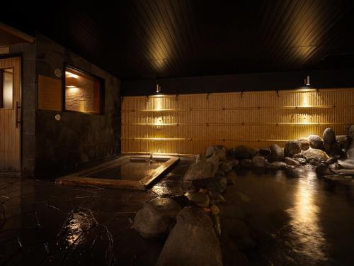 a room with a hot tub with lights on it at Grand Mercure Nara Kashihara in Kashihara