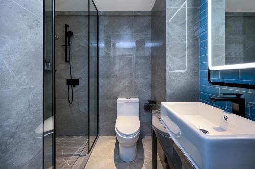 Koupelna v ubytování Echarm Hotel Guangzhou Dongpu Financial City Pazhou Convention Center - Free shuttle bus for Canton Fair