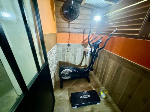 a room with an exercise bike in a room at residence caramboles in Fort-de-France