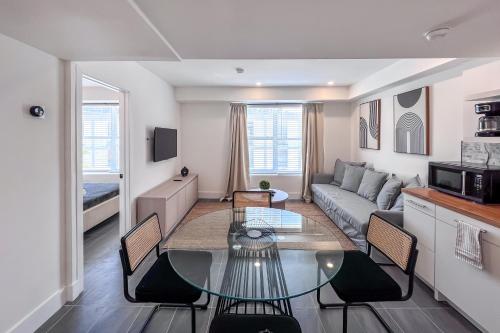 a living room with a couch and a table at Shaomi South Beach in Miami Beach