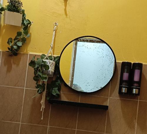 a mirror sitting on top of a tiled floor at Ninizam Kemaman Cukai Homestay in Cukai