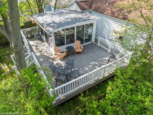 an aerial view of a house with a deck at Beachside Bliss, Steps to Beach in Michigan City