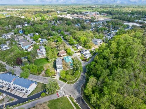 an aerial view of a town with houses and trees at Beachside Bliss, Steps to Beach in Michigan City