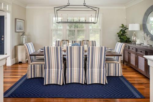 a dining room with a table and chairs at The Beachfront Estate, 360 Ocean Views, 5700 sqft in Mattapoisett
