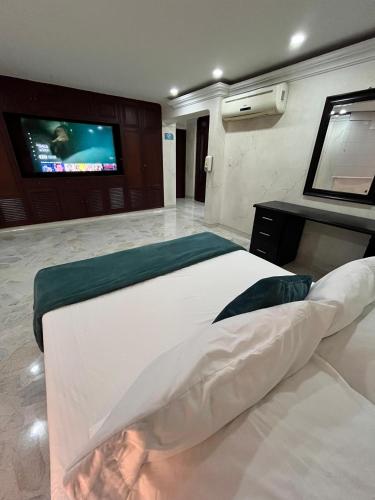 Ένα ή περισσότερα κρεβάτια σε δωμάτιο στο Hotel Ingenio NJ