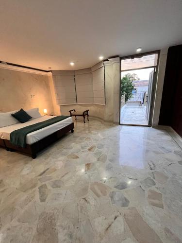 Ένα ή περισσότερα κρεβάτια σε δωμάτιο στο Hotel Ingenio NJ