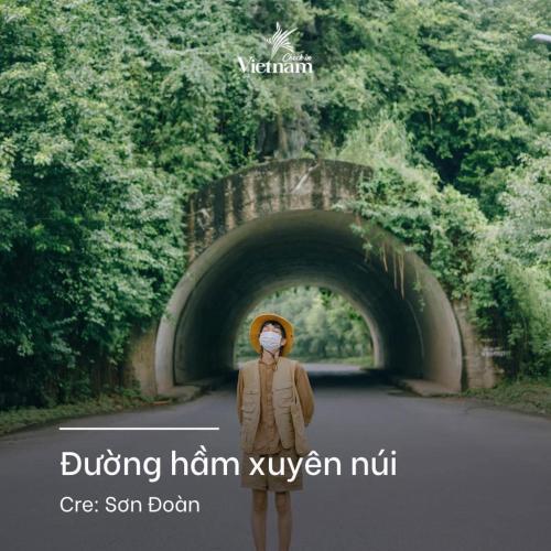 a man with a mask standing in the middle of a tunnel at Cherry homestay in Ninh Binh