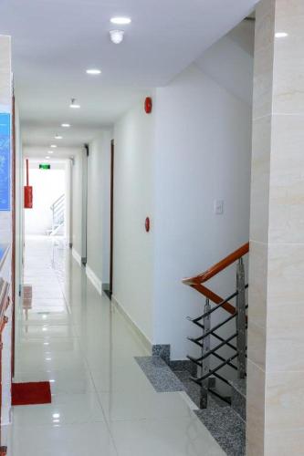 a hallway with a staircase in a building at Ha My Hotel in Ho Chi Minh City