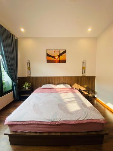 a bedroom with a large bed in a room at Hồng Vân Homestay in Cao Bằng