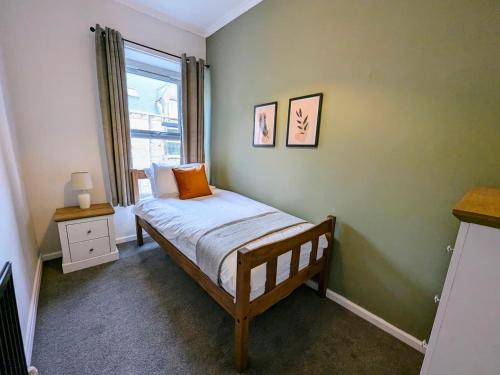 Ένα ή περισσότερα κρεβάτια σε δωμάτιο στο Spacious And Homey 4 Br House