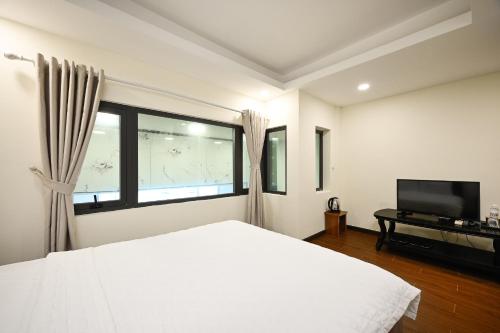 Katil atau katil-katil dalam bilik di Red Sun Airport Saigon Hotel