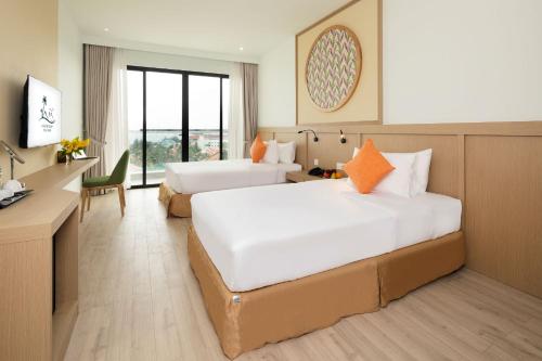 Postel nebo postele na pokoji v ubytování Hoan My Resort - Ninh Chu