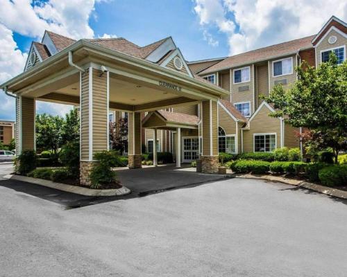 a house with a driveway in front of it at Quality Inn & Suites in Mount Juliet