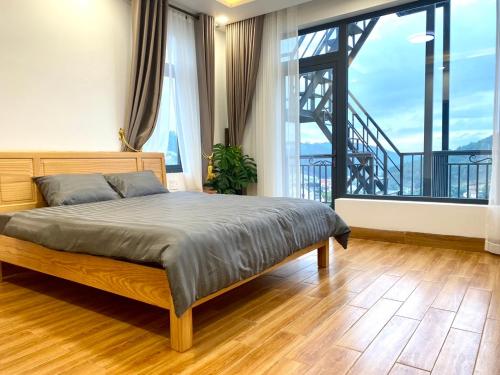 Postel nebo postele na pokoji v ubytování MH Villa DaLat