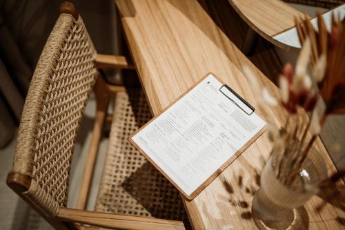 a table with a cell phone sitting on top at Kalani Residence in Keramotí