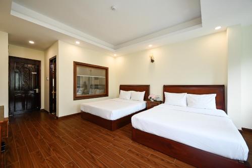 Katil atau katil-katil dalam bilik di Red Sun Airport Saigon Hotel