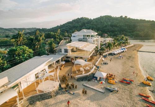 an aerial view of a beach with a building at Vitalis White Sands in Vigan