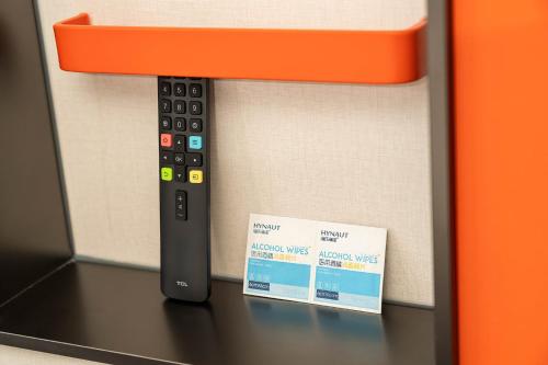 a remote control sitting on top of a microwave at Holiday Inn Express Xi'an Daxing by IHG in Xi'an