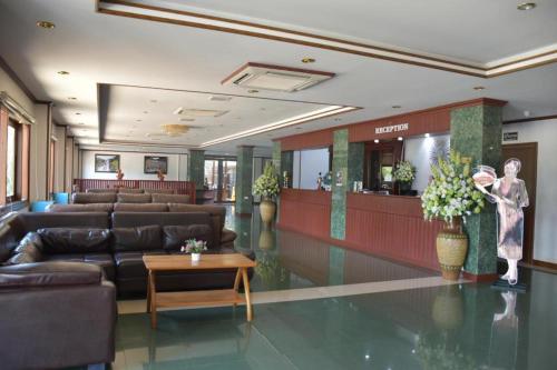a lobby with a waiting area with couches and a waiting room at Hungheuang Hotel in Savannakhet
