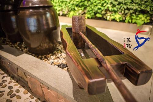 a model of a boat on a table with a vase at Yanji Yanbian International Hotel in Yanji