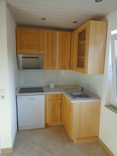 Una cocina o cocineta en Exclusive Apartment - Rees