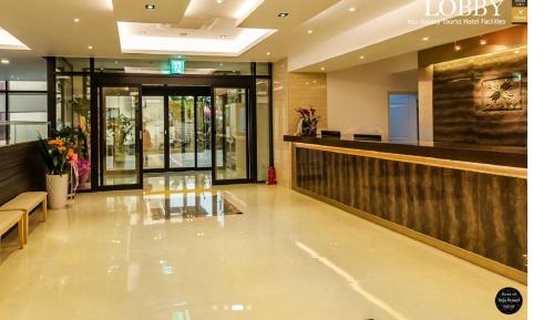 a lobby of a store with a reception desk at Galaxy Hotel in Jeju