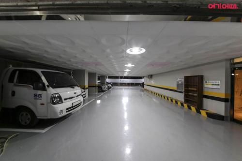 a parking garage with a white van parked in it at Hotel Primo Daejeon in Daejeon