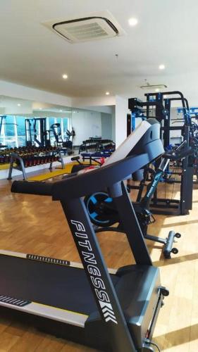 a gym with treadmills and a treadmill at Java Lotus Hotel Jember in Jember
