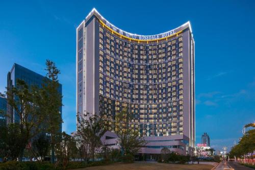 a tall building with lights on top of it at Rosedale Hotel Taicang in Taicang