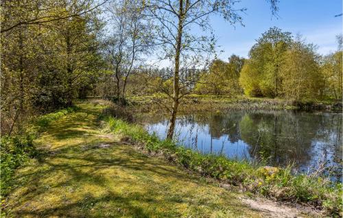 a path next to a body of water at 3 Bedroom Cozy Home In Bindslev in Bindslev