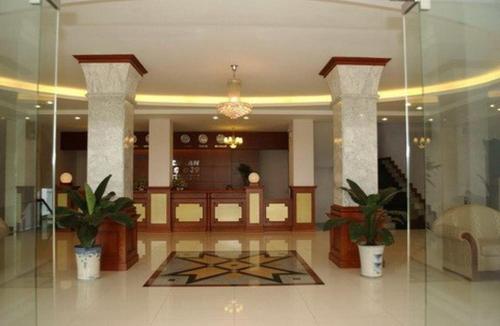 a lobby with potted plants in a building at HOTEL STAR 39 in Ho Chi Minh City