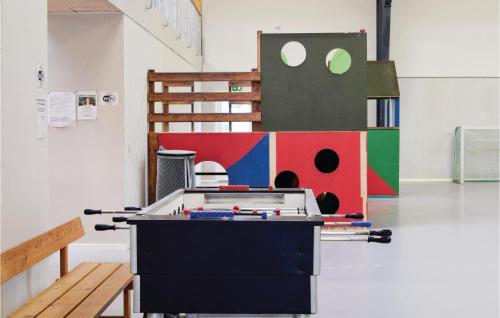 a ping pong table in the middle of a room at Terrassehus in Tranekær