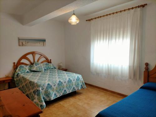 Postel nebo postele na pokoji v ubytování Apartamento frente al mar y en el centro