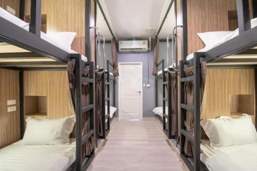 a group of bunk beds in a dorm room at OYO 726 Sookjai Cafe and Hostel in Chiang Mai