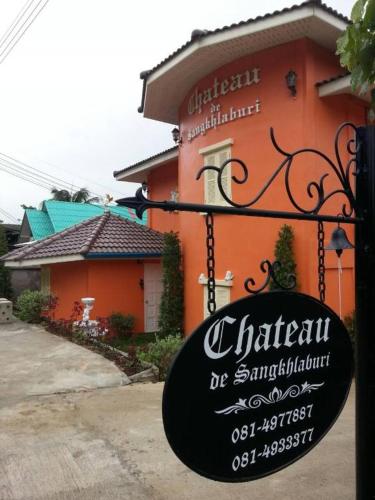 a sign for a restaurant in front of a building at Chateau de Sangkhlaburi in Sangkhla Buri
