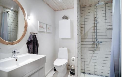 a bathroom with a sink and a toilet and a mirror at 3 Bedroom Gorgeous Home In Lem St in Karsbæk