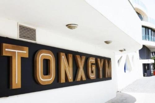 a sign on the side of a building at City Centre Luxury Residence with Pool near Dunya IVF & Beach in Kérynia