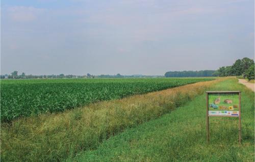 a sign in the grass next to a field at Stevenshof in Loerbeek