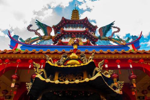 a building with dragons on the top of it at OYO 91296 Nagoya Guesthouse in Nagoya