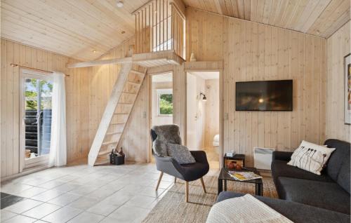 a living room with a staircase in a house at 5 Bedroom Nice Home In Hadsund in Hadsund