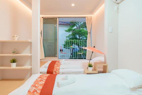 Postel nebo postele na pokoji v ubytování OHAYO Hotel 大森西