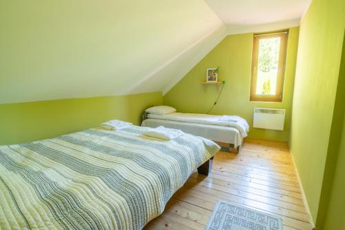 Ένα ή περισσότερα κρεβάτια σε δωμάτιο στο Hilltop The House Filia