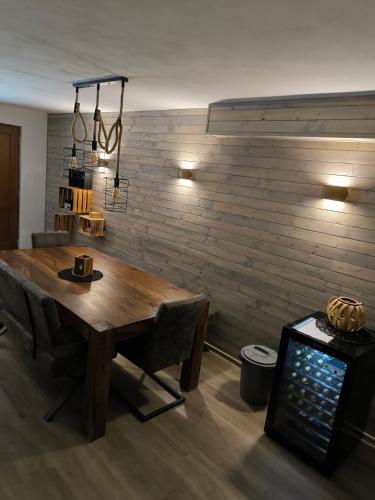 a wooden table in a room with a wall at Apartmán Vendelínka in Valtice