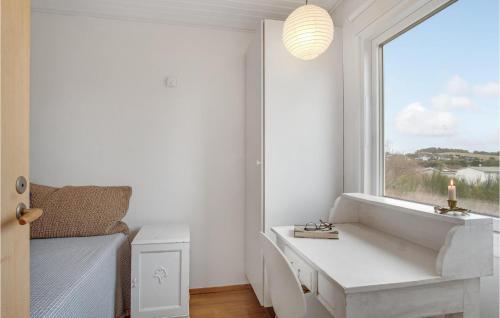 a white room with a window and a white desk at 3 Bedroom Awesome Home In Kalundborg in Kalundborg
