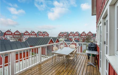 a balcony with a table and chairs on a building at Apartment Havnevej Nykøbing Sj V in Nykøbing Sjælland