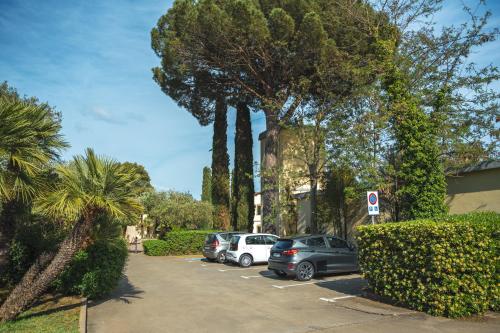a group of cars parked in a parking lot at Sella&Mosca Casa Villamarina in Alghero