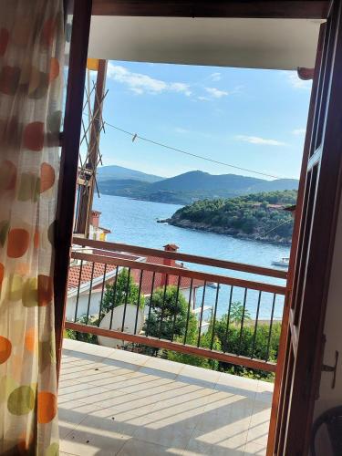 a view of the water from a balcony at Pyrgadikia 1BR Welcome stay Private Holiday House in Chalkidiki - Sithonia in Pyrgadikia