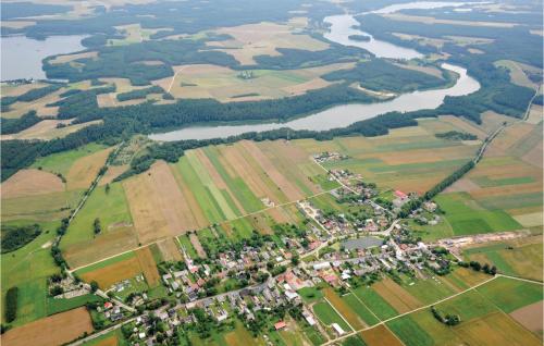 an aerial view of a village next to a river at Awesome Home In Brzezno Szlacheckie in Brzeźno Szlacheckie